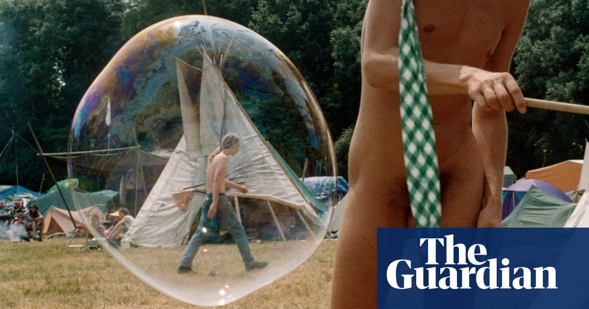 A naked man plays with bubbles at Glastonbury – Jocelyn Bain Hogg’s best photograph