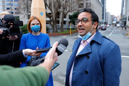 Gaurav Sharma talks to reporters on a street outside Wellington’s parliament building