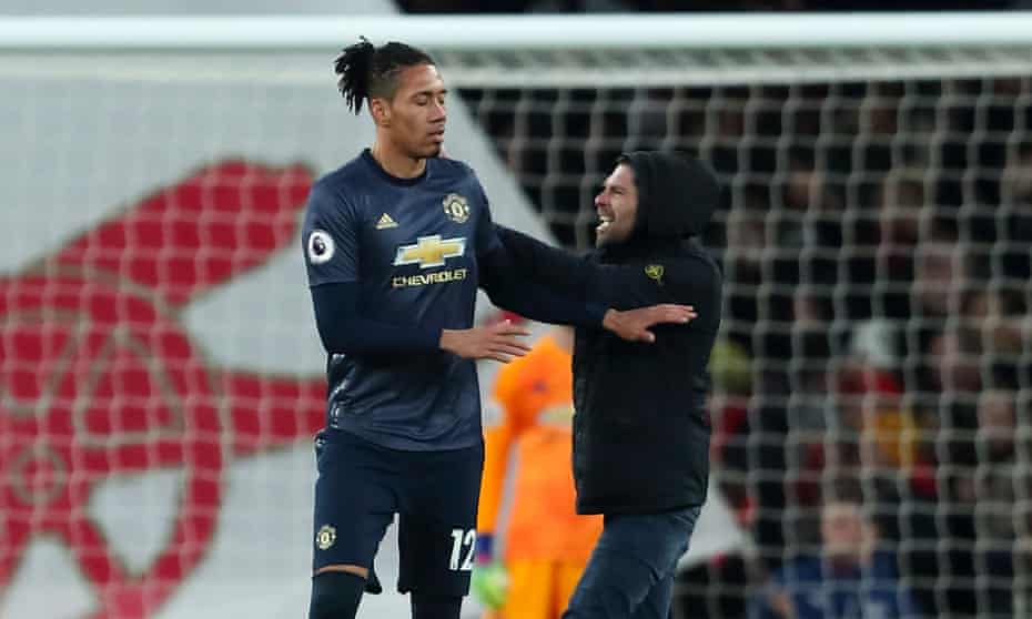 Chris Smalling was approached on the pitch by a supporter shortly after Arsenal had scored to make it 2-0. 