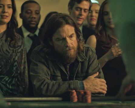 Jason Bateman playing Vince sits at a poker table