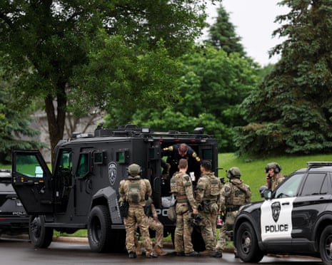 Camo people in army jeep on suburban street