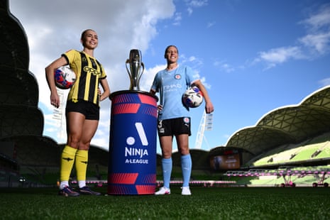 Wellington Phoenix skipper Mackenzie Barry and Melbourne City skipper Rebekah Stott airs pinch nan A-League Women title trophy astatine AAMI Park