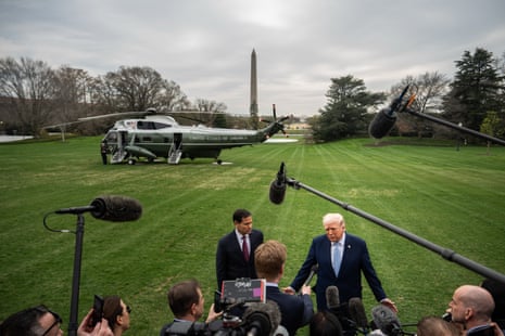 President Donald Trump, accompanied by Secretary of State Marco Rubio, speaks with reporters while departing the White House