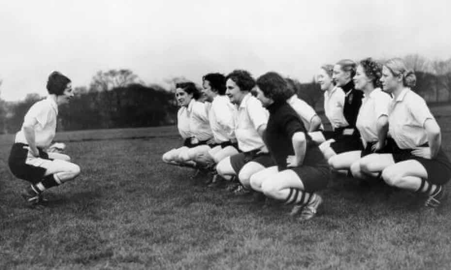 Lily Parr (left), pictured leading Preston training as their captain.