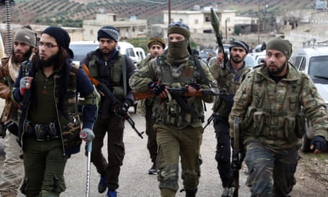 Turkish-backed Syrian rebels enter the village of Qastal, north of Afrin
