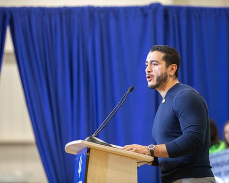 Man stands at lectern