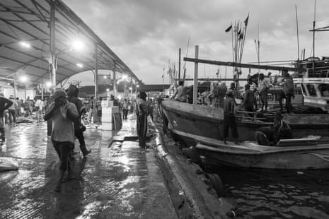 At sunrise in Negombo, the nightly fish market quietens down and fishers start to return home after many days at sea.