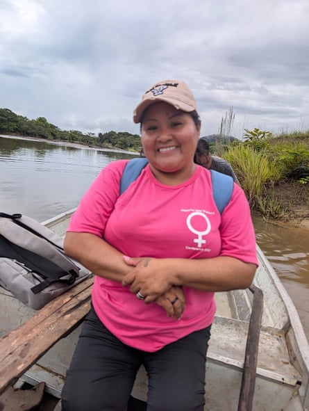 A mestiza Latina woman in a boat