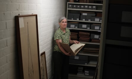 Emily Naish, the archivist and collections manager at Salisbury cathedral, holding one of the institution’s many records.