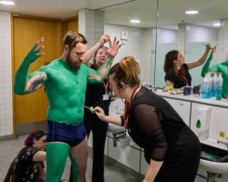 Actor and stuntman James Unsworth has his body painted green in preparation for his role as the executioner.