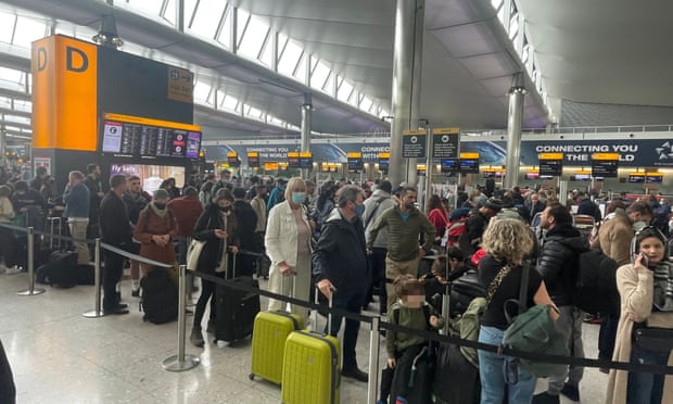 Queue of travellers at Heathrow Terminal 2
