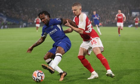 Chelsea’s Raheem Sterling shields the ball from Arsenal’s Oleksandr Zinchenko.
