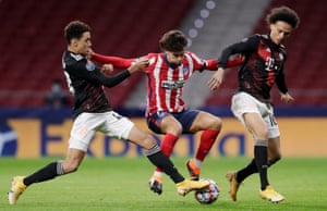 Jamal Musiala tackles João Félix on Tuesday, with Leroy Sané close by.