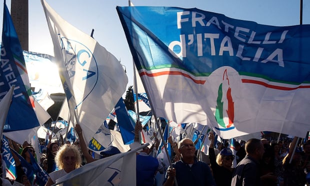 The tricolour logo of Brothers of Italy at a rally in Rome on Thursday