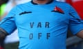 A Nottingham Forest fan in a shirt saying “VAR OFF”