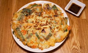 ‘Spring onion weaves in and out of curls of squid’: seafood pajeon.