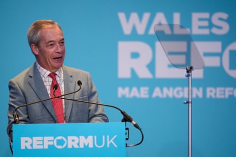 Reform UK leader Nigel Farage delivers a speech during a rally at the International Convention Centre Wales in Newport.