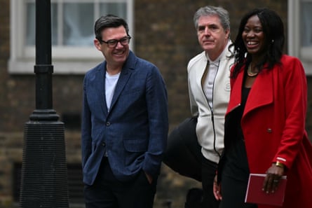 Andy Burnham and Miatta Fahnbulleh smiling and chatting as they visit Downing Street