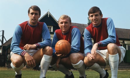 West Ham players Martin Peters, right, with Geoff Hurst, left, and Bobby Moore, take a break from training.