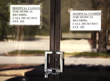 Closed signs hang on a recently closed Pickens County Medical Center in Carrollton, Alabama, in 26 March 2020.