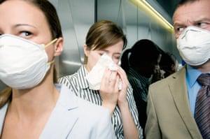 Woman blowing her nose
