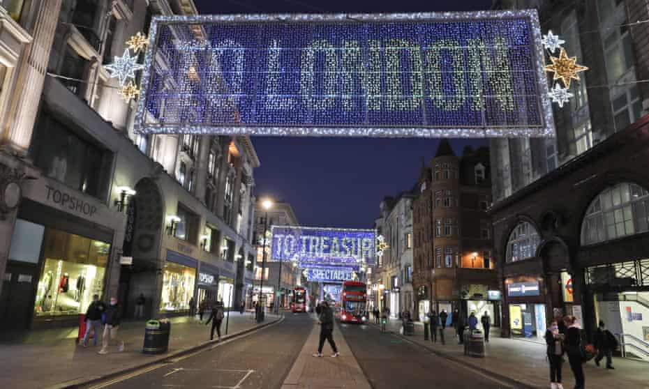 Christmas lights twinkle over a near-empty Oxford Street, central London.