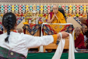 The Dalai Lama watches a musical performance