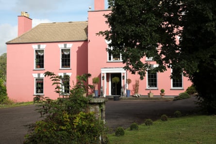La vie en rose: the coral pink exterior of the house.