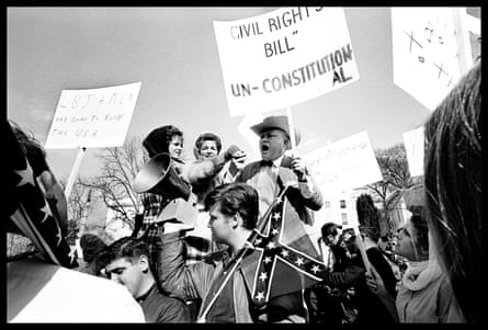 people yelling with signs