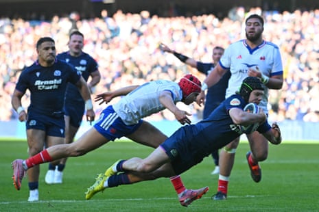 Scotland’s wing Darcy Graham dives over the French tryline to line to score their sixth try and his second of the match.