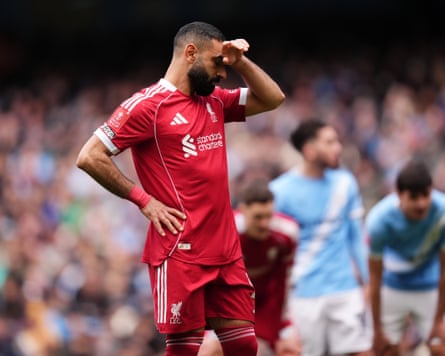 Mohamed Salah reacts aft his punishment was saved by Manchester City keeper James Trafford.