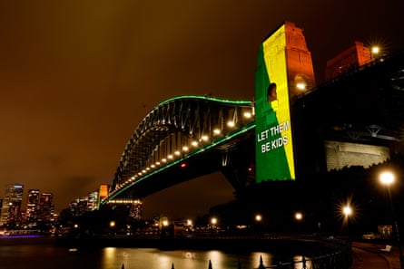 The Sydney Harbour Bridge is illuminated on the first day of the national under-16 social media ban coming into effect