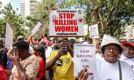 Kenyan protesters hold placards and shout slogans