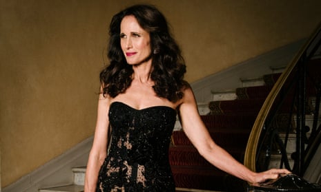 Andie MacDowell on a staircase in a black dress