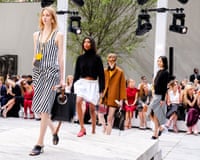 Line of models walking along the outdoor catwalk