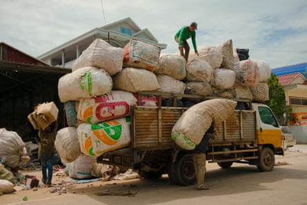 Sorted cans are loaded on to truck at recycling plant by port in Sihanouk, Cambodia.