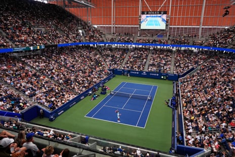 Francisco Comesana (foreground) serves to Flavio Cobolli.