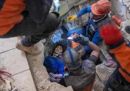 Emergency personnel rescue 16-year-old Melda Adtas from the rubble of a collapsed building in Hatay, southern Turkey, on Thursday.