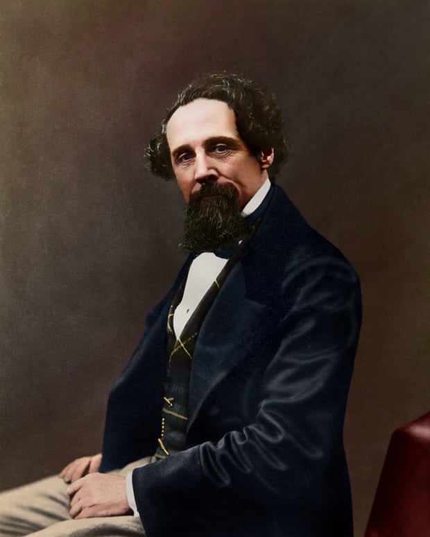 A colourised photograph, originally black and white, of a 47-year-old Dickens.
