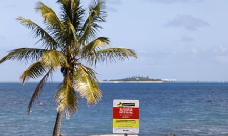 A board warning about shark dangers at a beach on Goose Island in Noumea.