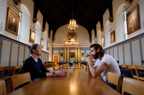 Jenna Armstrong and Seb Benzecry, the respective women’s and men’s presidents of Cambridge University Boat Club, hold a meeting to discuss their plans in the Great Hall at Jesus College on 5 March 2024.