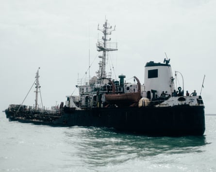 The crew of the ship are suspected to be smuggling oil. The Nigerian police has seized their boat in the Gulf of Guinea and is holding them on ship arrest