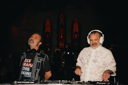 Two DJs performing