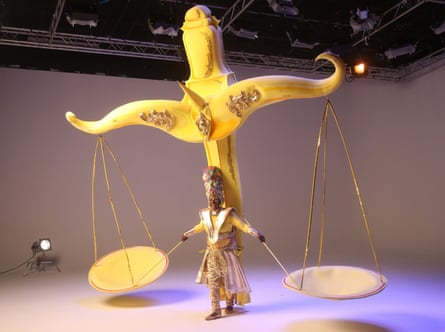 In the balance ... A performer from mas band Mahogany is filmed in a studio for the virtual Notting Hill carnival.