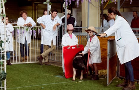 Asher Blenkiron and Zarlei Mears show their pigs at the Sydney Easter Show
