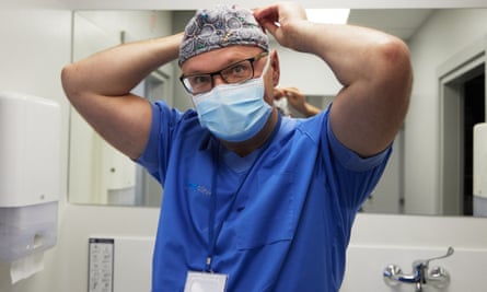 Orthopaedic surgeon Sarunas Tarasevicius prepares for surgery.