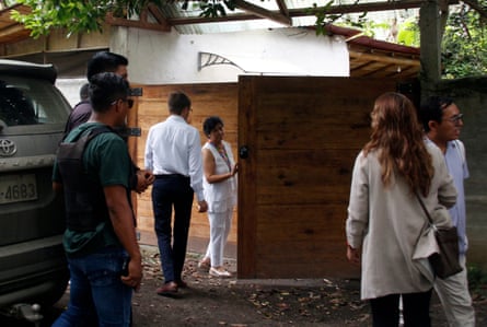People gather outside Monika Silva Koniuszek’s home