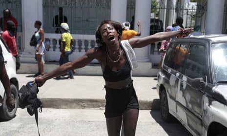 A woman shouts out how her family members died at the hands of gangs members during a protest against insecurity in Port-au-Prince.