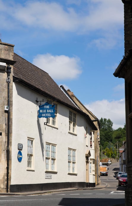 Pub with sign reading The Blue Ball Hotel