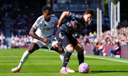 Leeds’ Brenden Aaronson holds off Fulham’s Ryan Sessegnon